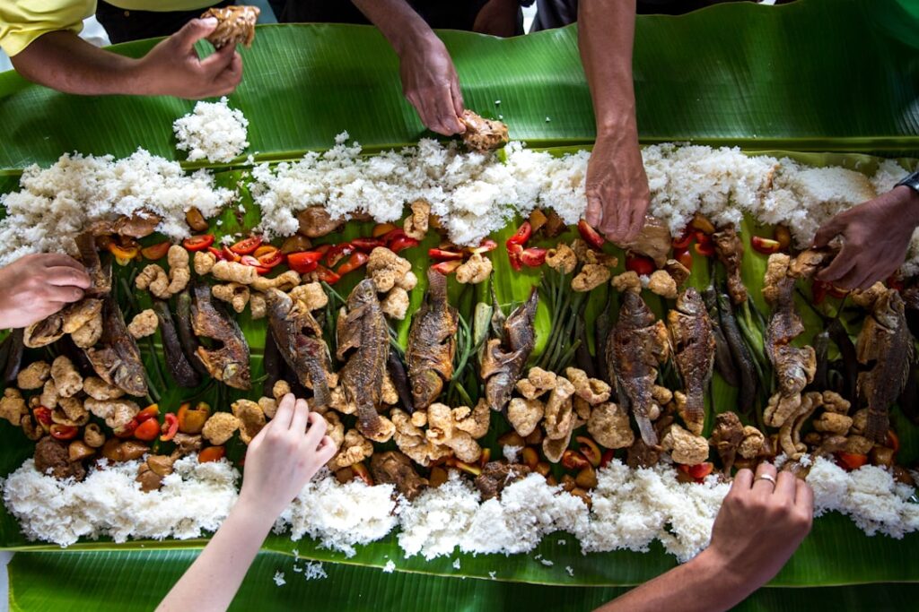 Traditional Filipino boodle fight feast served on banana leaves – a signature of lutong bahay restaurant branding and hospitality.